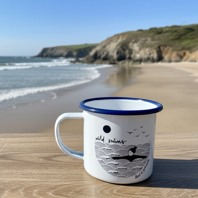 Mug with wave design and text on a wooden surface
