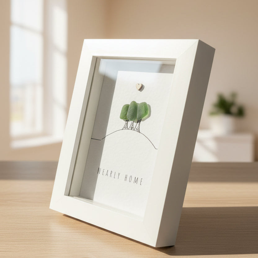 Book with a small plant on a wooden surface