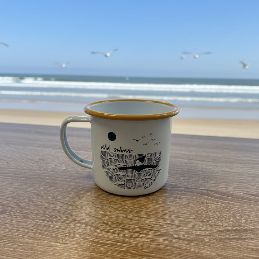 Mug with gold rim and black illustrations